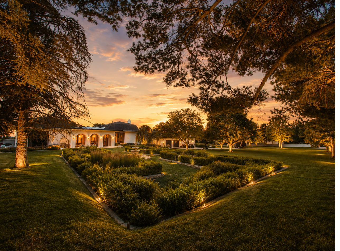 Formal parterre garden lit at dusk